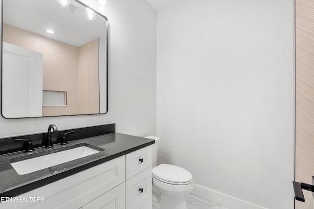 bathroom with vanity, visible vents, baseboards, toilet, and marble finish floor