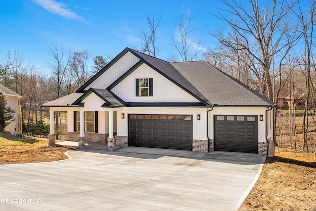 modern farmhouse style home with concrete driveway, a garage, brick siding, and a shingled roof