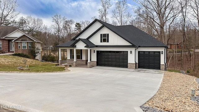 modern farmhouse featuring a front lawn, concrete driveway, an attached garage, a shingled roof, and brick siding