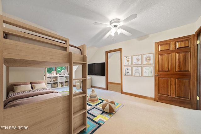 carpeted bedroom featuring a ceiling fan and baseboards