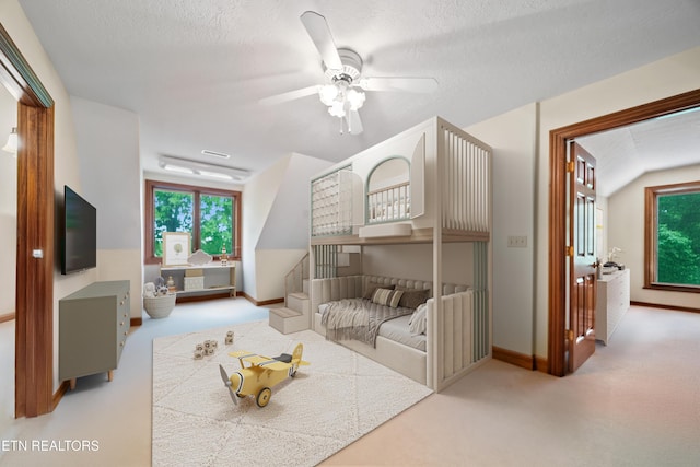 bedroom with carpet floors, a ceiling fan, and baseboards