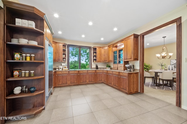 kitchen featuring brown cabinets, open shelves, a notable chandelier, stainless steel fridge, and recessed lighting