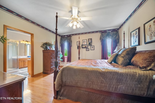 bedroom featuring light wood-style floors, ceiling fan, and ensuite bath