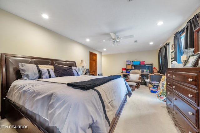 bedroom with light colored carpet, recessed lighting, and a ceiling fan