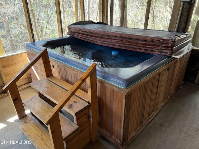 exterior space with a hot tub