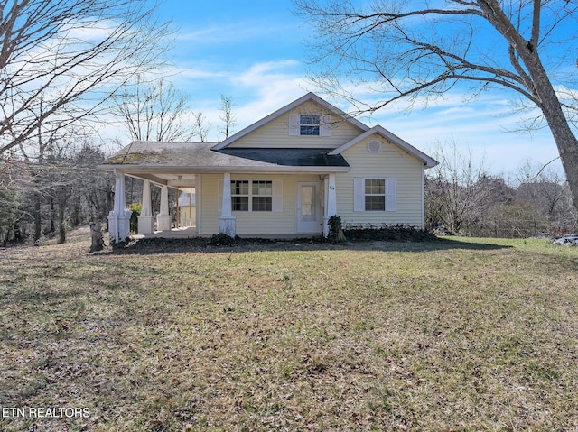 view of front facade with a porch and a front lawn