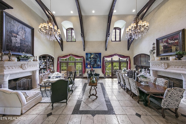 living room featuring stone tile flooring, a fireplace, and an inviting chandelier