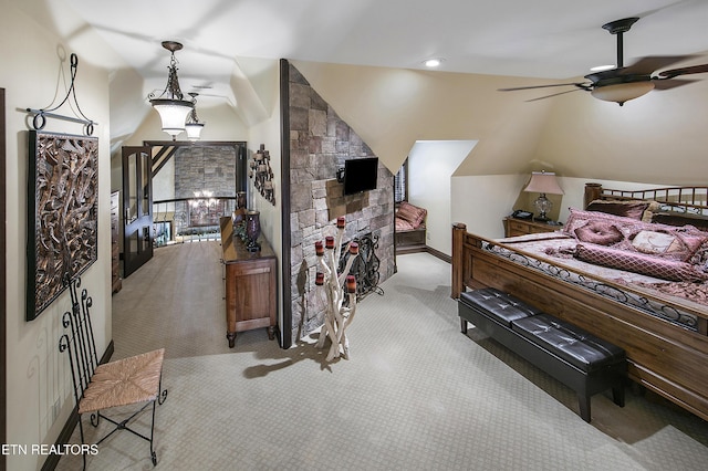 bedroom featuring carpet floors, vaulted ceiling, and a ceiling fan