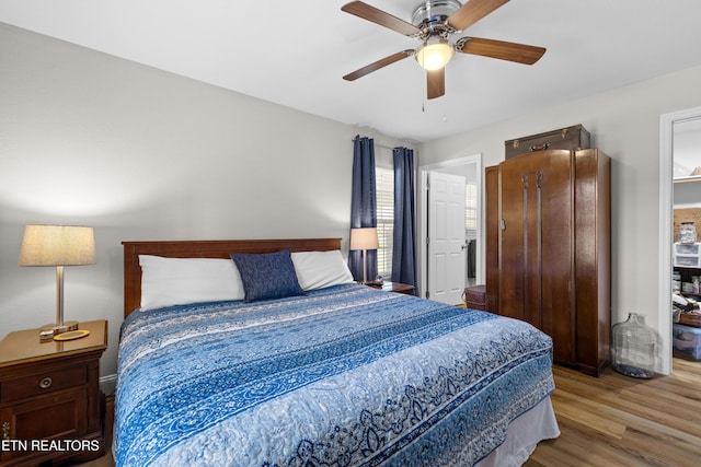 bedroom with ceiling fan and wood finished floors