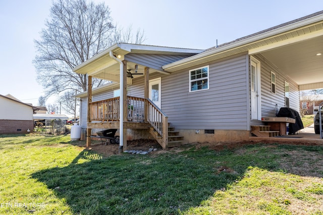 exterior space featuring crawl space and a yard