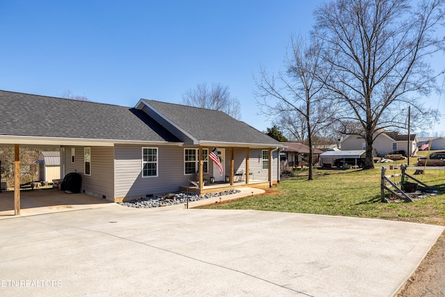 ranch-style house with driveway, an attached carport, roof with shingles, crawl space, and a front yard