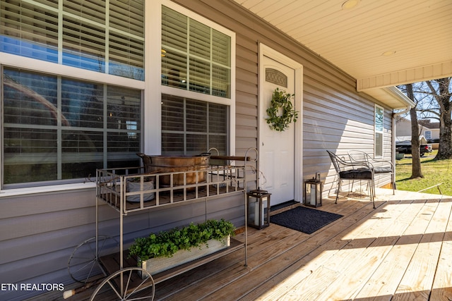 wooden terrace with covered porch