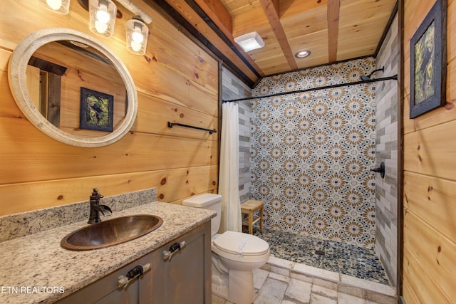 full bath featuring a stall shower, stone tile floors, toilet, wood ceiling, and vanity