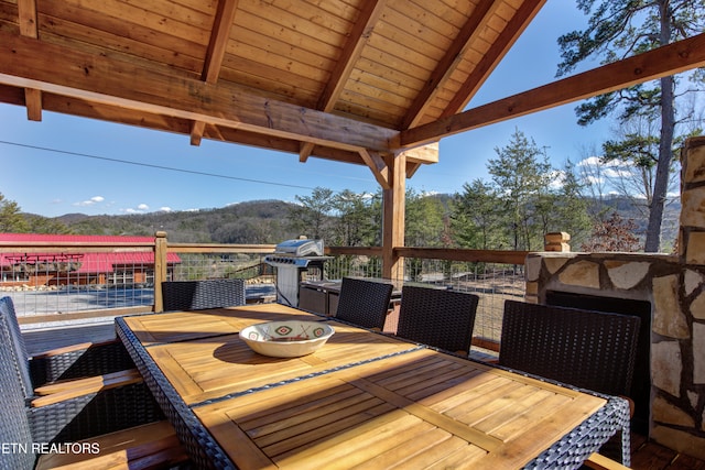 deck featuring outdoor dining area