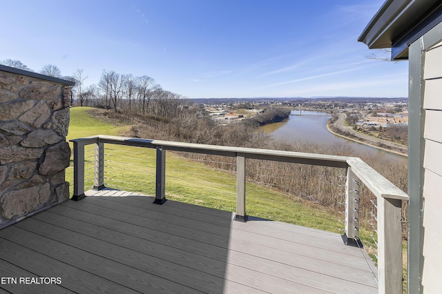 deck featuring a water view and a yard