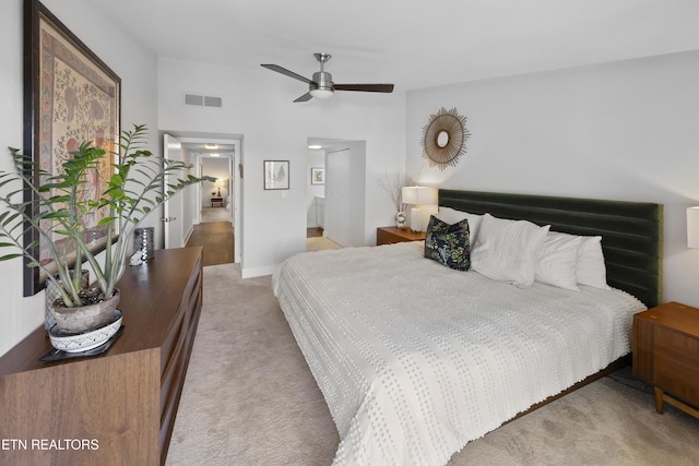 bedroom with light colored carpet and visible vents