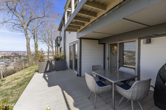 wooden deck with outdoor dining area