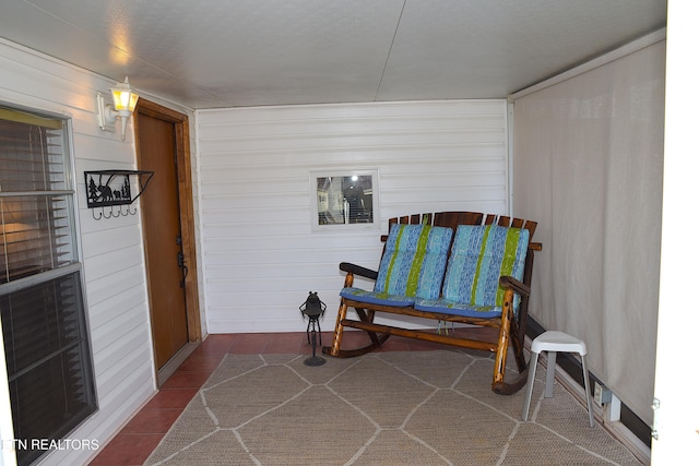 living area featuring tile patterned floors