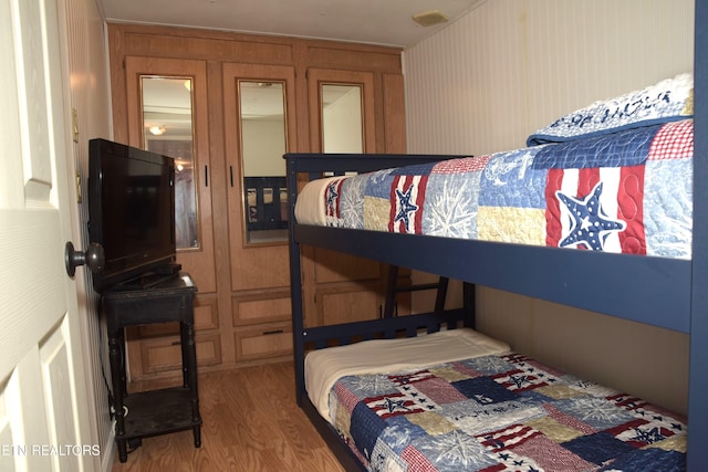 bedroom featuring wood finished floors