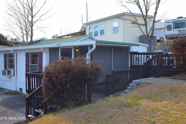 view of front of property featuring cooling unit