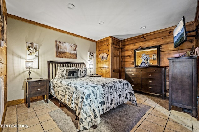 tiled bedroom with wood walls and recessed lighting