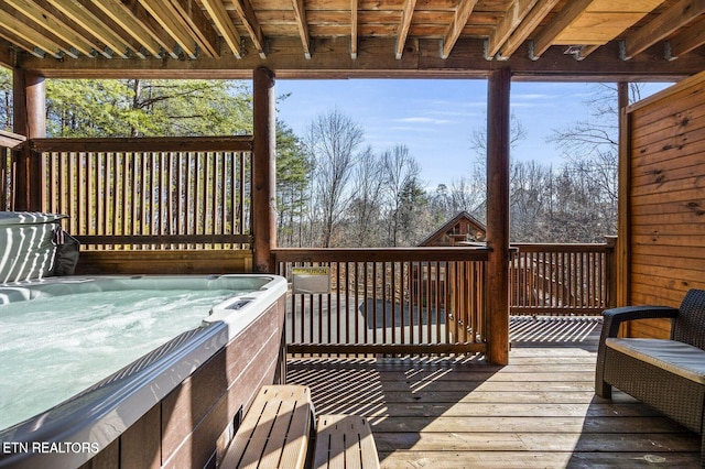 deck with a hot tub