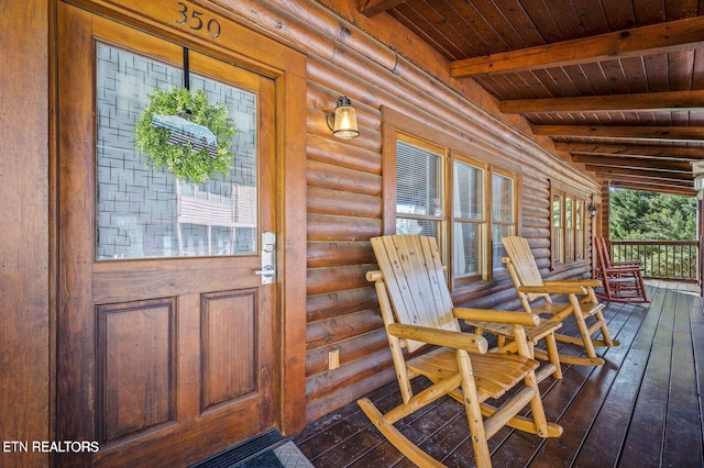 entrance to property with log exterior