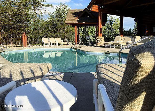 view of swimming pool with a patio, fence, and a fenced in pool