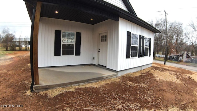 entrance to property with a patio area