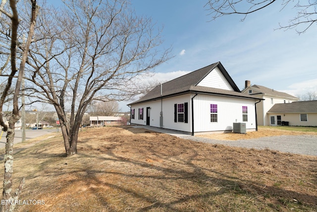 1229 N Main St, Sweetwater, TN 37874 - view of property exterior with central AC and a shingled roof