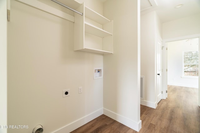1229 N Main St, Sweetwater, TN 37874 - clothes washing area featuring wood finished floors, baseboards, hookup for an electric dryer, hookup for a washing machine, and laundry area