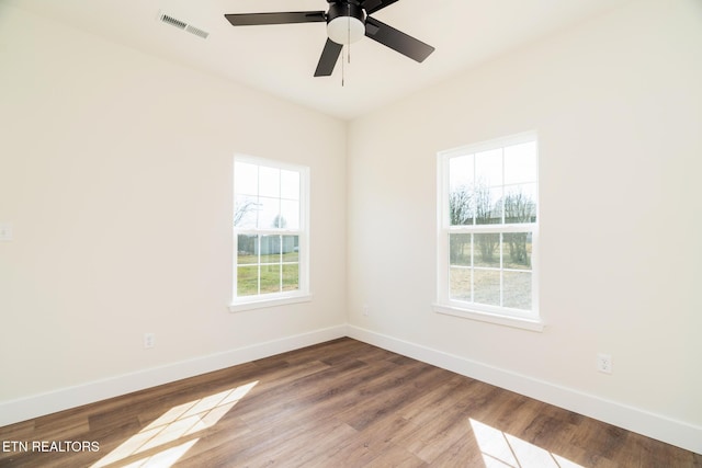 1229 N Main St, Sweetwater, TN 37874 - empty room featuring visible vents, wood finished floors, and baseboards