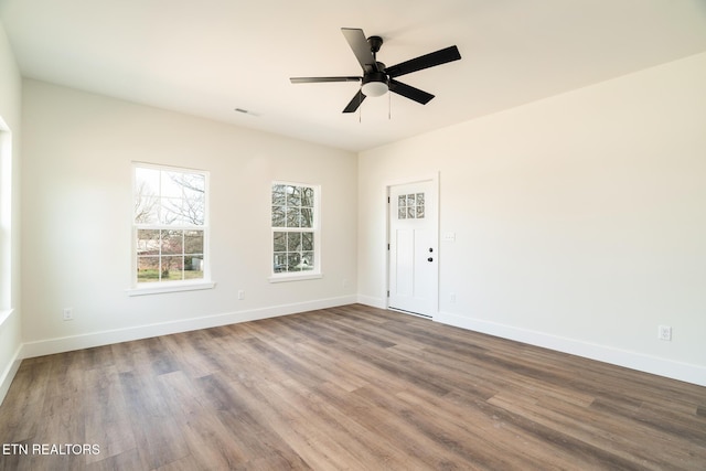 1229 N Main St, Sweetwater, TN 37874 - empty room with wood finished floors, baseboards, and ceiling fan
