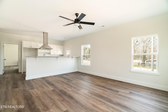1229 N Main St, Sweetwater, TN 37874 - unfurnished living room featuring dark wood-style floors, baseboards, and ceiling fan