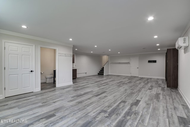 below grade area with recessed lighting, stairway, and crown molding