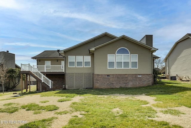 back of house with a wooden deck, stairs, central AC, a chimney, and a yard