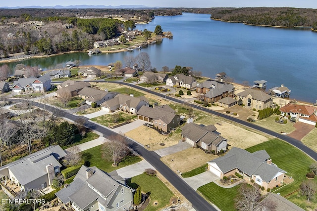 aerial view featuring a residential view and a water view