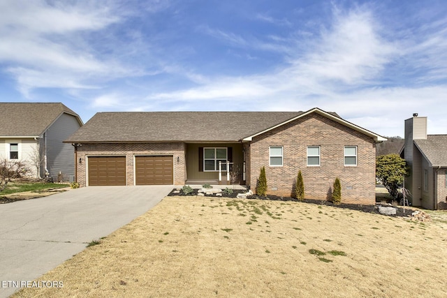 ranch-style home with brick siding, driveway, and a garage