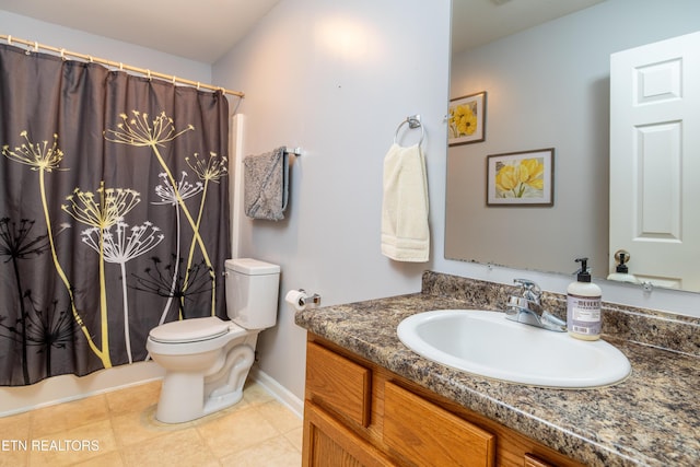 bathroom featuring baseboards, toilet, tile patterned flooring, shower / bath combination with curtain, and vanity