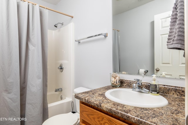 bathroom with toilet, shower / bath combo with shower curtain, and vanity