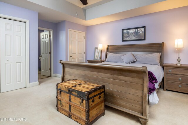 bedroom with baseboards, a ceiling fan, and light colored carpet