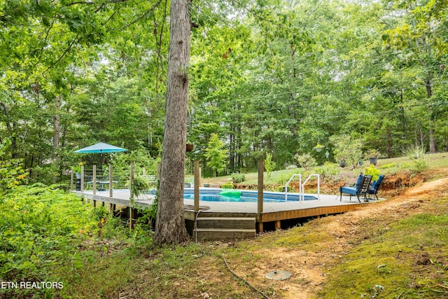 pool featuring a view of trees