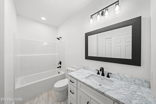 bathroom featuring toilet, marble finish floor, vanity, and bathing tub / shower combination