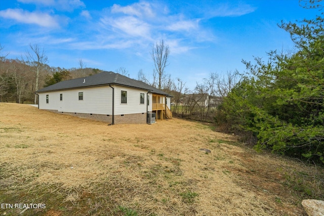 view of property exterior with crawl space and central AC