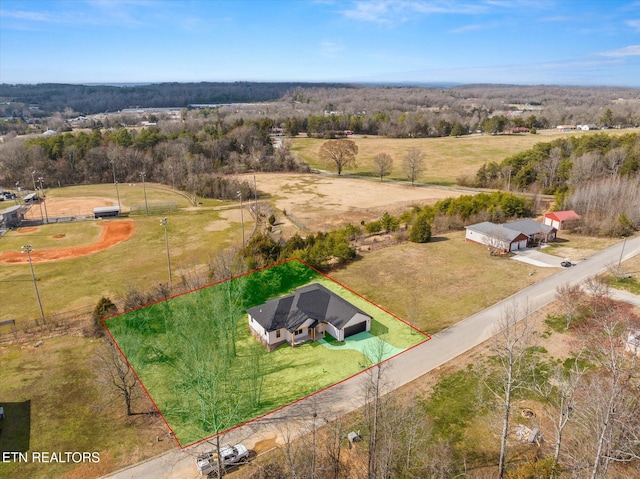 birds eye view of property featuring a rural view