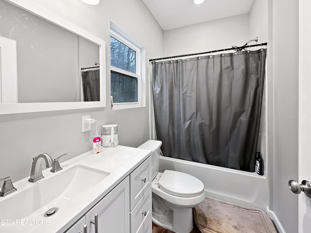 bathroom with toilet, shower / bath combo, and vanity