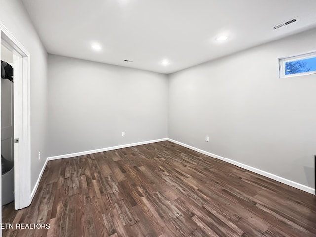 interior space with recessed lighting, dark wood finished floors, visible vents, and baseboards