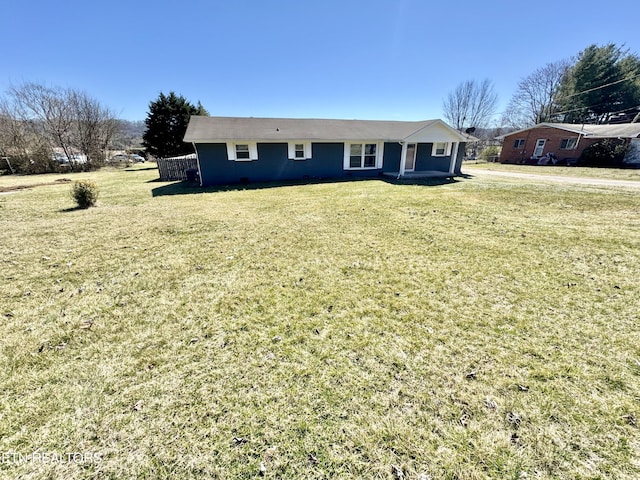 single story home featuring a front yard