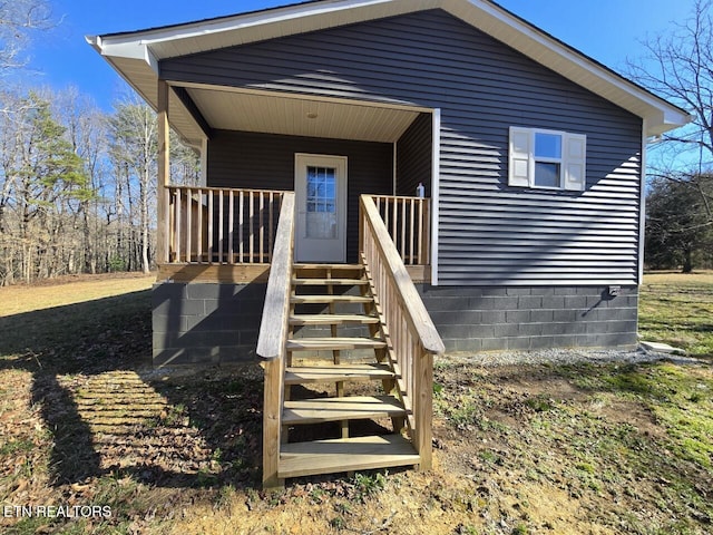 view of front of property featuring a porch and stairway