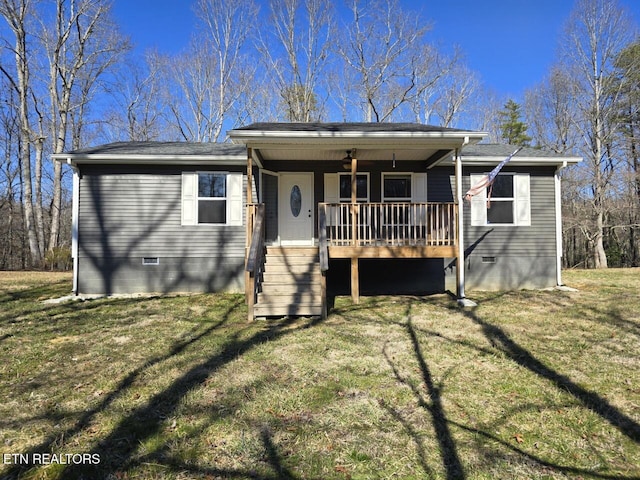 single story home featuring crawl space, a shingled roof, and a front lawn